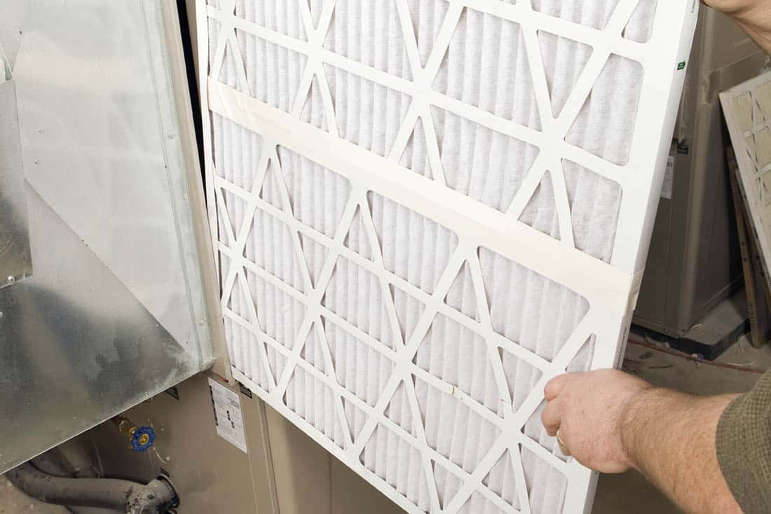 Close-up of furnace filter near heating system